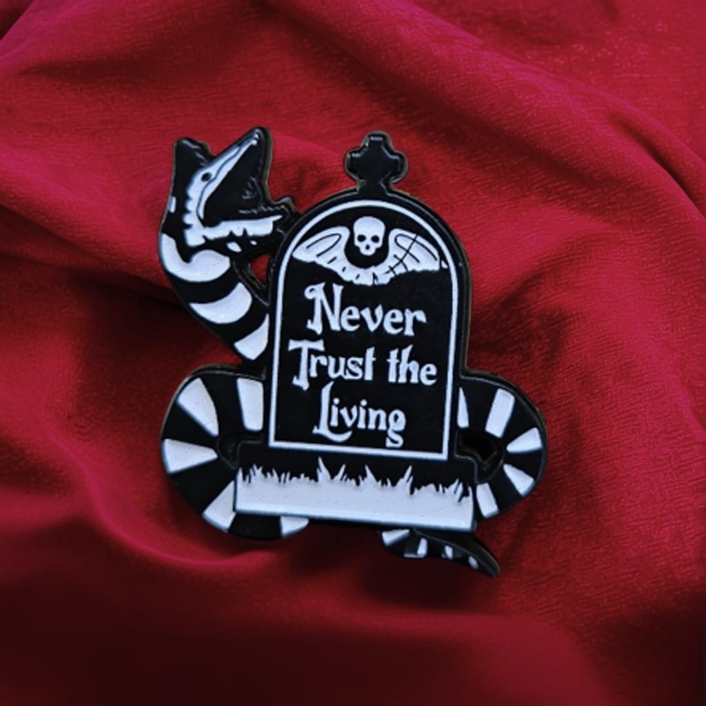 "Never Trust the Living" Metal Pin – Beetlejuice Tombstone Lapel Badge