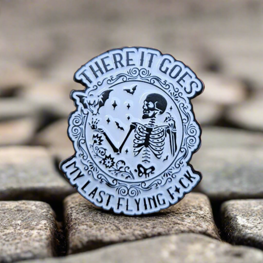 There It Goes Enamel Pin – Flying Bats & Skeleton Metal Badge