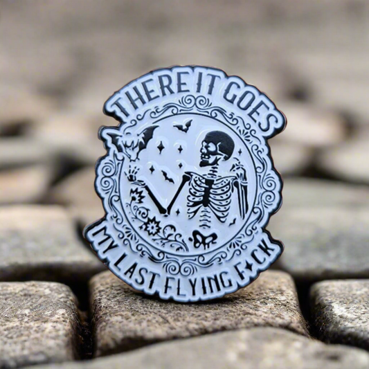 There It Goes Enamel Pin – Flying Bats & Skeleton Metal Badge
