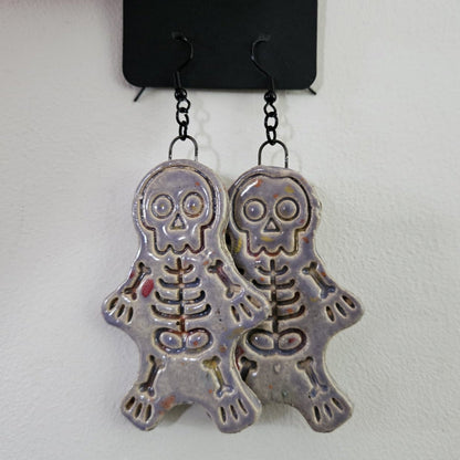 Spooky Scary Skeleton Earrings – Handmade Eerie Charms, 6×3 cm by Red Raven Pottery