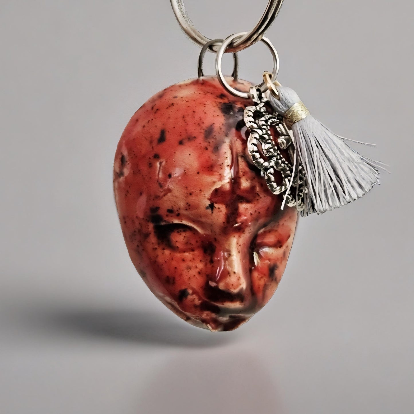 Doll Face Keychains – Eerie Ceramic Charms, 4×3 cm, various designs by Red Raven Pottery