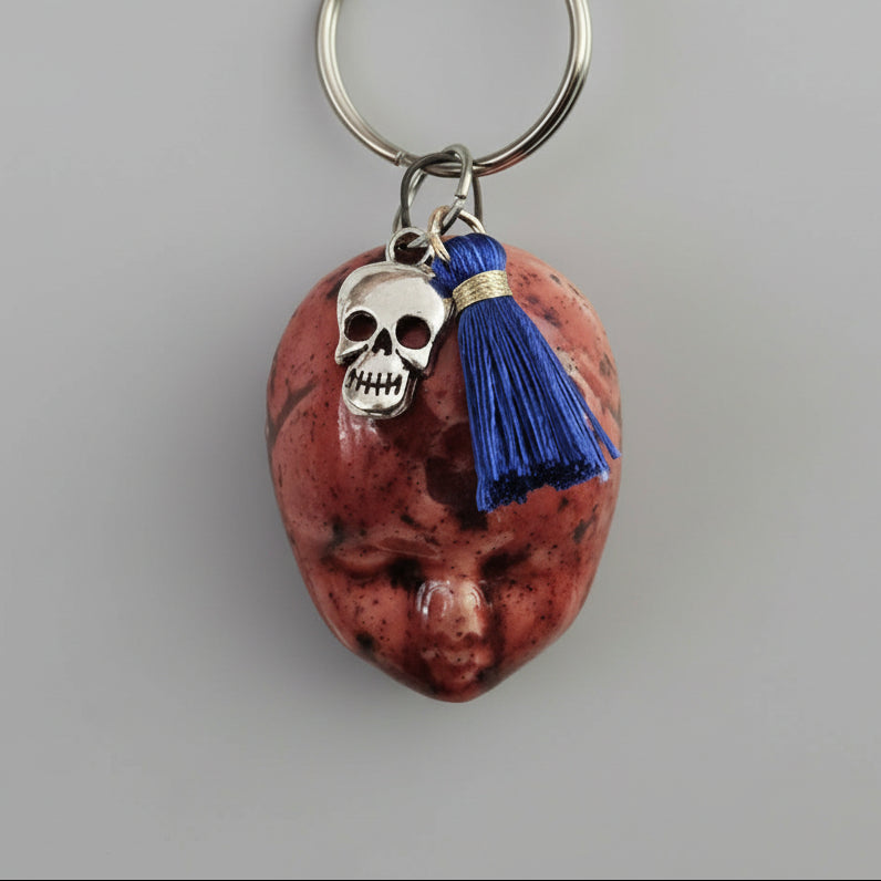 Doll Face Keychains – Eerie Ceramic Charms, 4×3 cm, various designs by Red Raven Pottery