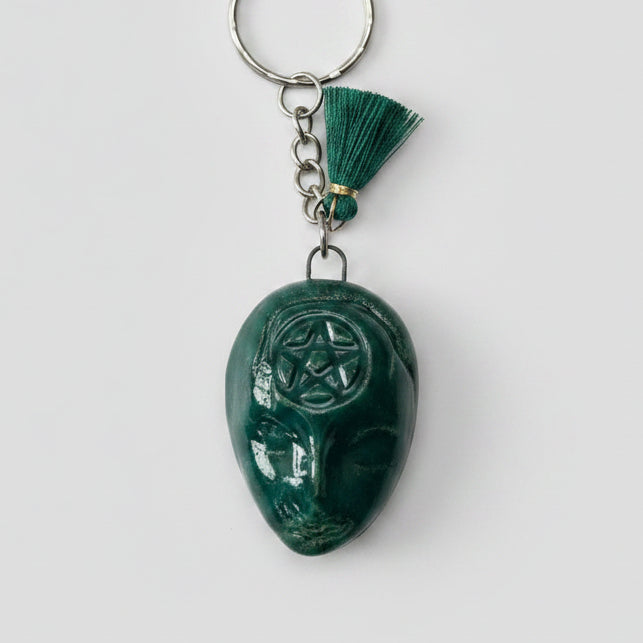 Doll Face Keyring – Enigmatic Ceramic Charm, 4 × 3 cm by Red Raven Pottery