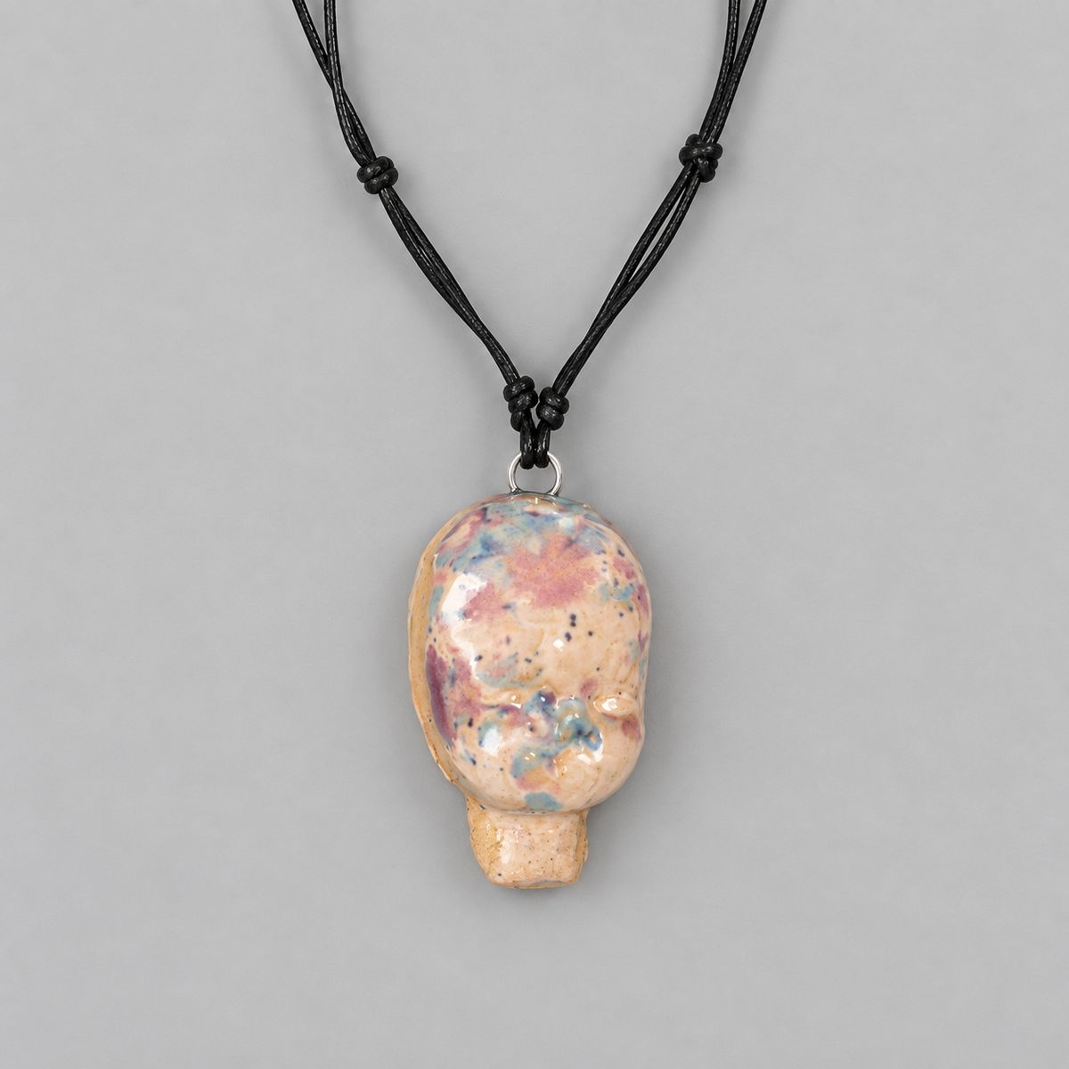 Doll Head Handmade Ceramic Necklace – Eerie Faceless Pendant, 5.5 × 3.5 × 2 cm by Red Raven Pottery