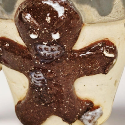 Frostbitten Gingerdead Ceramic Coffee Cup – Twisted Holiday Chaos, Ø9×8 cm by Red Raven Pottery