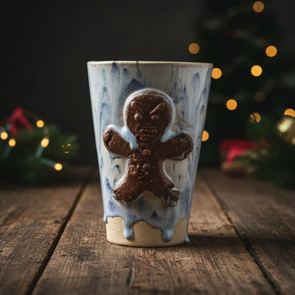 Frostbitten Gingerdead Ceramic Tumbler – Twisted Holiday Chaos, Ø8×12 cm by Red Raven Pottery