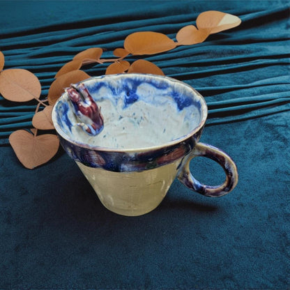Handmade drowning doll teacup