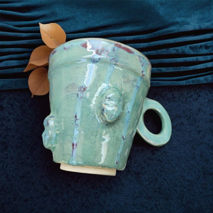 Handmade Green teacup lange skull