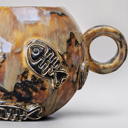 Earthfire Ceramic Teacup – Amber Glazed Fishbone Cup, Ø9.5×11 cm by Red Raven Pottery