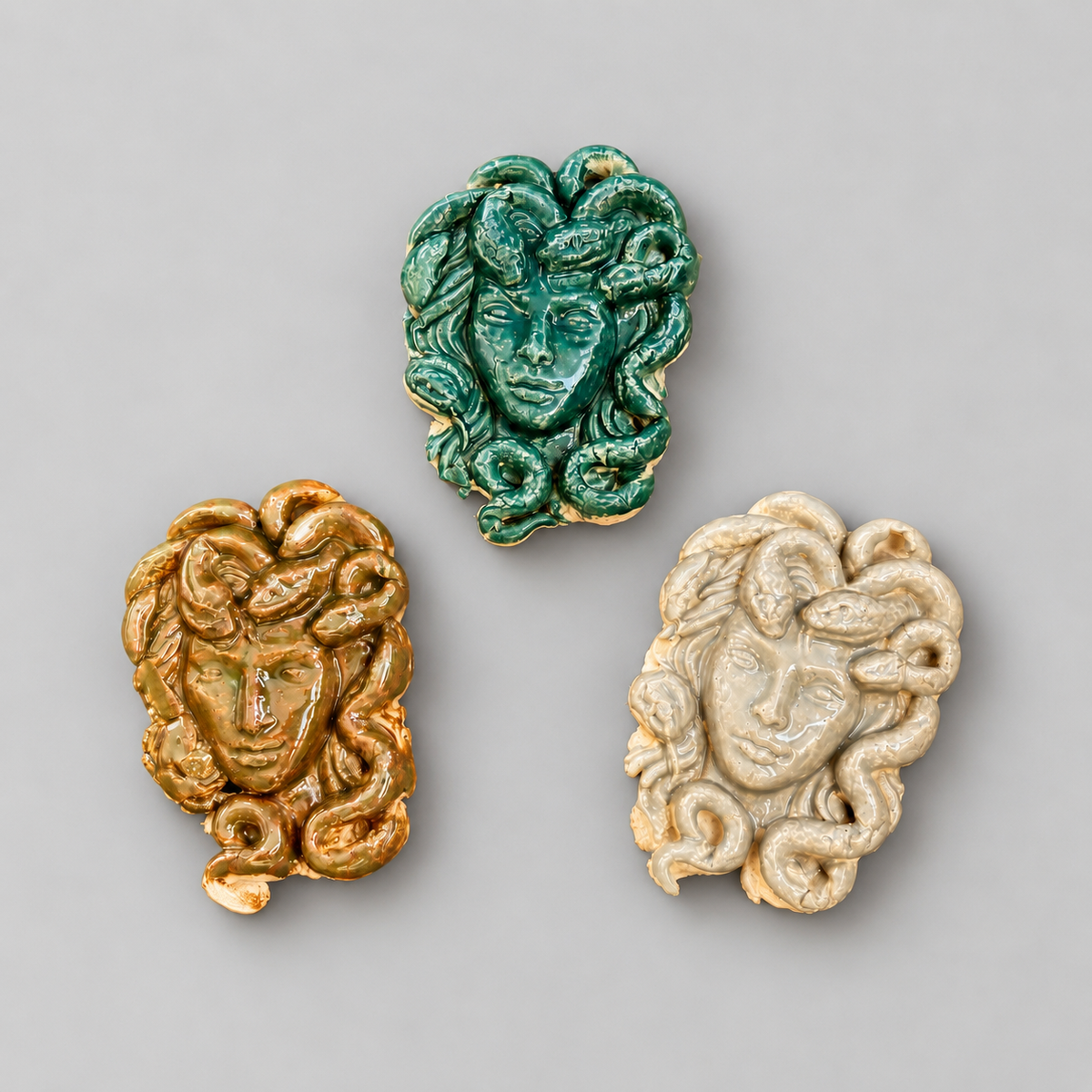 Medusa’s Gaze Handmade Ceramic Fridge Magnet – Mythological Ornament, 7 × 4.5 × 0.5 cm by Red Raven Pottery