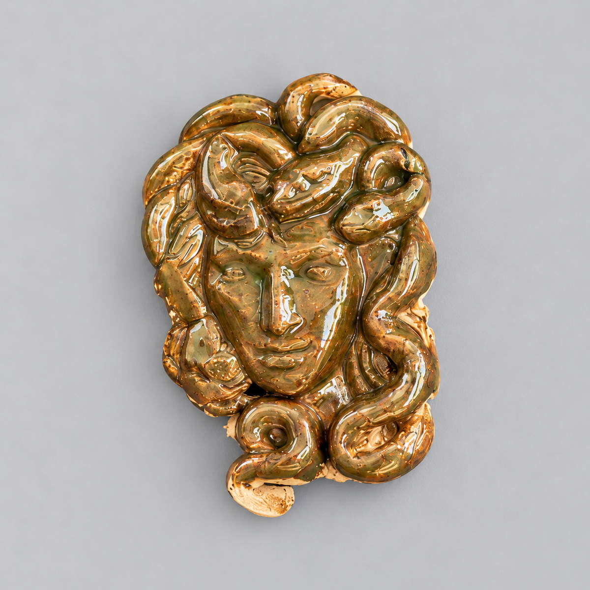 Medusa’s Gaze Handmade Ceramic Fridge Magnet – Mythological Ornament, 7 × 4.5 × 0.5 cm by Red Raven Pottery