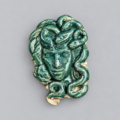 Medusa’s Gaze Handmade Ceramic Fridge Magnet – Mythological Ornament, 7 × 4.5 × 0.5 cm by Red Raven Pottery