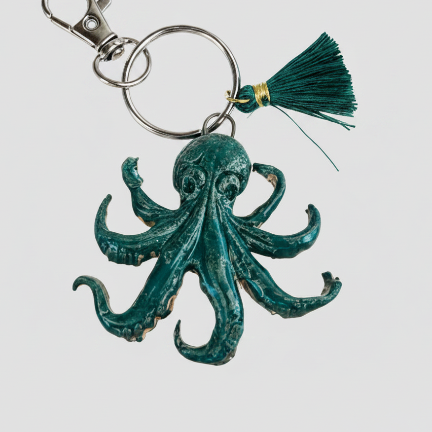 Octopus Drift Keyring – Deep Sea Ceramic Charm, 6.5 × 5 cm by Red Raven Pottery