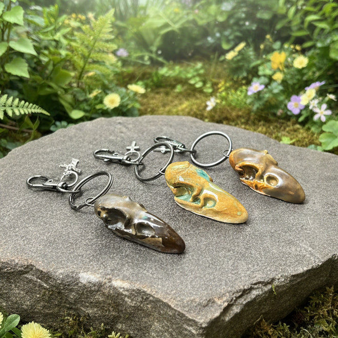 Raven Skull Ceramic Keychain – Charm of Death & Becoming, 5×2×1.5 cm by Red Raven Pottery