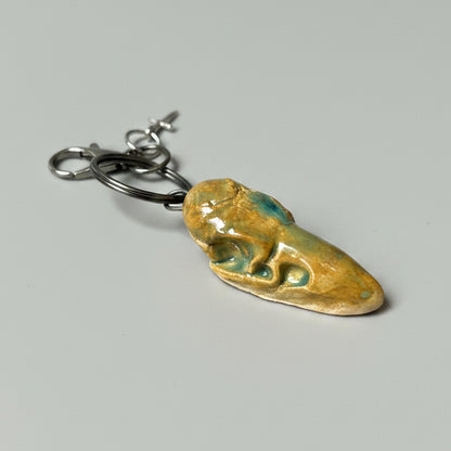 Raven Skull Ceramic Keychain – Charm of Death & Becoming, 5×2×1.5 cm by Red Raven Pottery